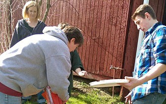 Volunteers helped remove or cover graffiti that had been spray painted onto 15 buildings at the Kitsap County Fairgrounds.