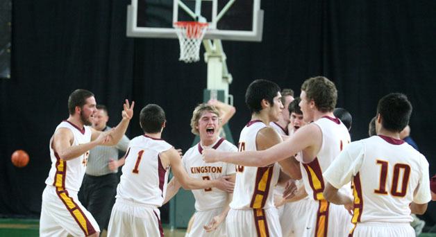 Kingston celebrates a third place finish Saturday at the state 2A basketball tournament in Yakima.
