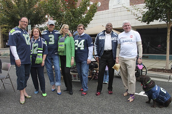 Kitsap County officials showed off their shoes last Saturday in the YWCA's Walk in Her Shoes event. They formed the team 'Kitsap County Seahawk Guys and Gals.'