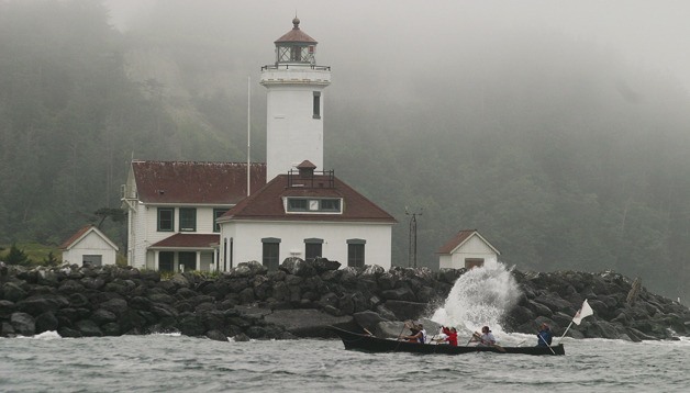 Port Gamble S'Klallam's Trevathan family canoe rounds Point Wilson on July 15 after the Coast Guard ordered Tribal Journeys canoes back to shore.
