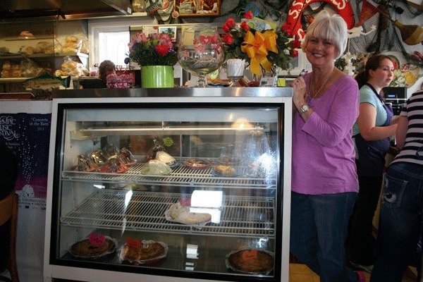 Owner Barbie Mills of Barbie’s Seabeck Bay Café poses near her pie case on her last day of work. Mills and her husband decided to retire after 13 years in the restaurant business.