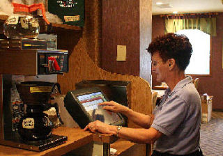 Longtime Family Pancake House waitress Irene Masterson completes an order on the Kitsap Way restaurant’s computer. Family Pancake House is celebrating 45 years in business next week.