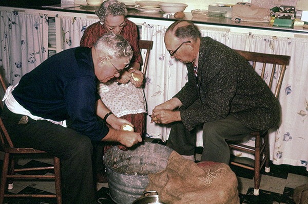 Sig Antonson and Selmer Myreboe help peel spuds for a circa 1950s lutefisk dinner.