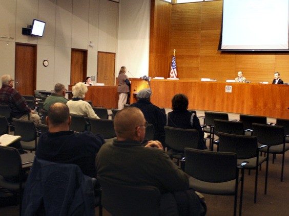 Citizens take in an evening meeting of the Board of Kitsap County Commissioners. Monday