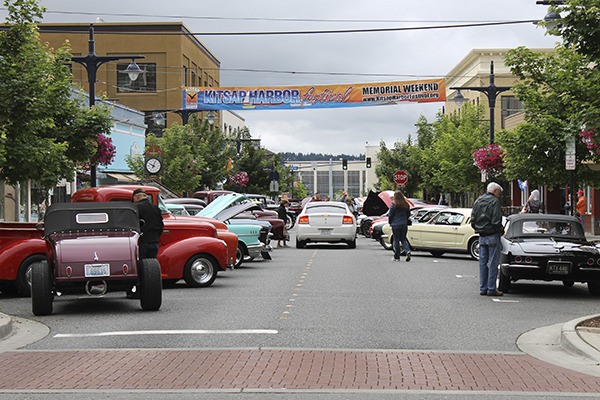 Locals wander through the Kitsap Car Cruz as part of the Kitsap Harbor Festival in downtown Bremerton.