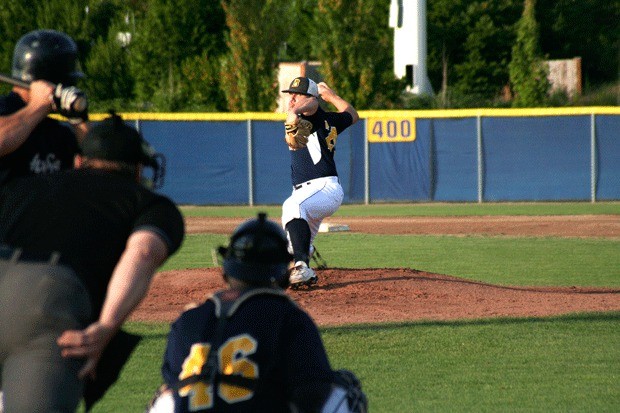 Kitsap BlueJackets starter David Macey throws a pitch Tuesday during the second inning of the club’s 3-2 loss to the Wenatchee AppleSox at Gene Lobe Field at the Kitsap County Fairgrounds.