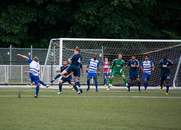 Brandon Scott fires an unsuccessful shot on the Whitecaps goal Saturday.