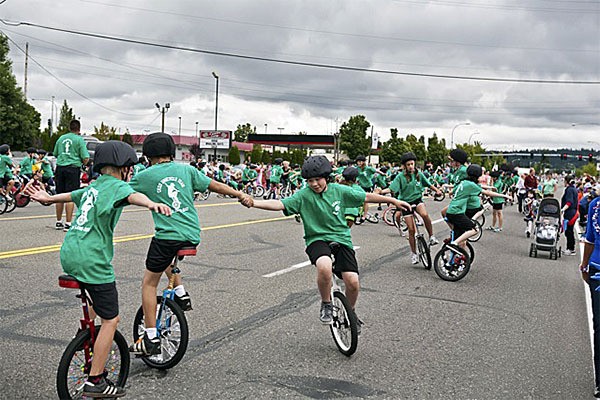 Unicyclists show their skills during the Whaling Days Parade in 2012.
