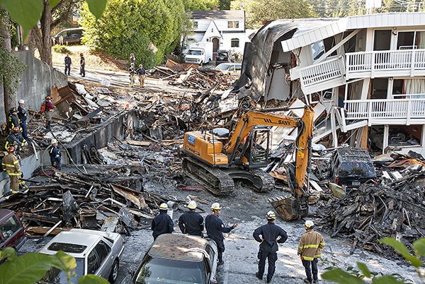 Responders look at the aftermath of an explosion at the Motel 6 on Kitsap Way Aug. 18.