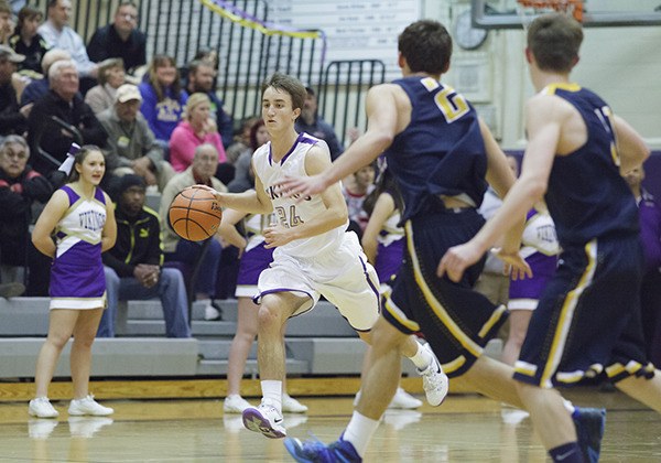 North Kitsap’s Josh Benson drives to the basket during the non-conference game against the Bainbridge Spartans on Dec. 1 in the North Kitsap Gymnasium.
