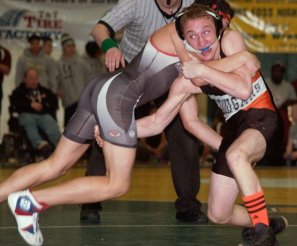 Central Kitsap’s Josiah Milcic grapples with Shelton’s Caleb Ragsdale in the championship finals for the 132-pound classification. Milcic won the match