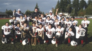 Courtesy Photo  The NK Pee Wees White right after they won the championship game. Team members: Zach Clark No. 26