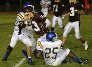 South Kitsap running back Sean Allison plows upfield against Stadium on Friday night.