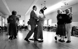 Kim and Mary Barker (center) joined about a dozen other adults for a beginning folk dancing class at the Poulsbo Sons of Norway Hall in this file photo. The Poulsbo Sons of Norway will hosts folk dancing lessons at 18891 Front Street. Beginners are welcome