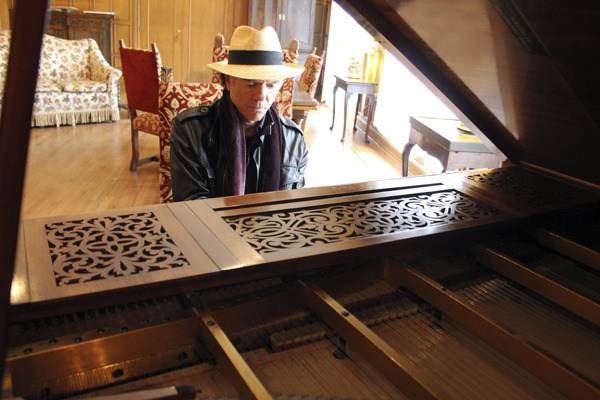 Craig Freeman freestyles on a piano in a conference room at Northwest College of Art & Design. The piano once owned by a former prime minister of Poland.