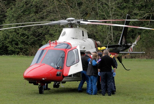 A 34-year-old Kingston woman was airlifted to Harborview Medical Center in Seattle for injuries sustained after she exited the passenger side of a moving truck. She was then run over by the truck.