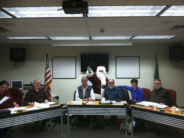 Santa pays a visit to a meeting of the North Kitsap Fire & Rescue Board of Commissioners in 2011. He’ll be back at the Paul T. Nichols headquarters fire station Dec. 17 for the station’s Holiday Open House.