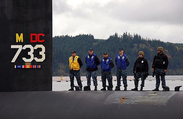 Sailors assigned to the Blue crew of the Ohio-class ballistic missile submarine USS Nevada (SSBN 733) standby topside in this file photo.
