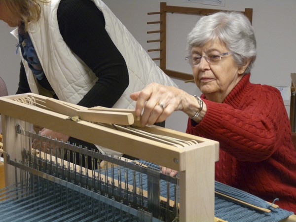 Audrey Klein works at her loom during a Kitsap Weaving School class.
