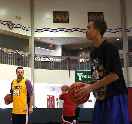 Bremerton High School senior standout guard Andre Coleman (right) steps up for his next shot in a game of H.O.R.S.E. at the Bremerton YMCA last week. Coleman defeated sports writer Mike Baldwin by four letters in the pickup basketball game.
