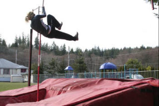 King’s West senior Irene Moore practices the pole vault during practice Tuesday.