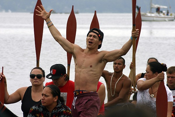 DeShawn Joesph of the Tulalip canoe ha?k stiquiw — Big Brother — asks permission for his canoe family to come ashore at Port Gamble S'Klallam's Point Julia July 20 during the 2013 Canoe Journey/Paddle to Quinault.