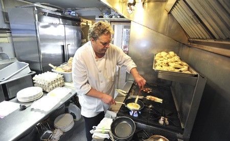 Chef David Fricke cooks up a breakfast order in the Dockside Grill’s kitchen. The restaurant opened for family dining in March on the Suquamish waterfront and recently began serving a full breakfast menu. The Dockside Grill is open 11 a.m. to 9 p.m. daily and serves breakfast 8-11 a.m. on weekends.