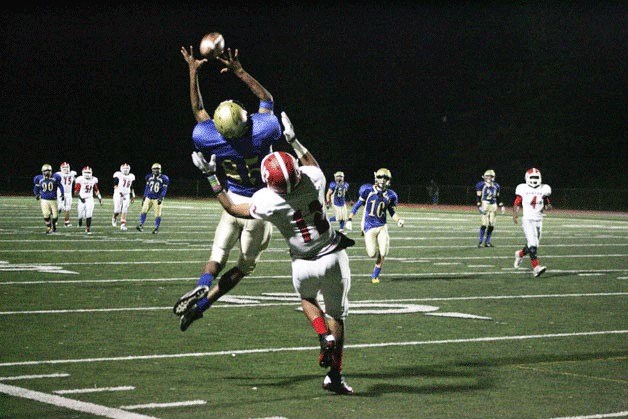 Shaquille Jones tries for an interception  over Kenny Green for Renton High Nov. 2 at Silverdale Stadium.