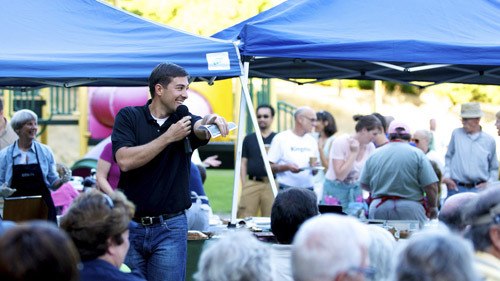 Kingston Rotary Club President Clint Boxman auctioned more than 60 pies at the third annual Pie in the Park fundraiser in 2011.