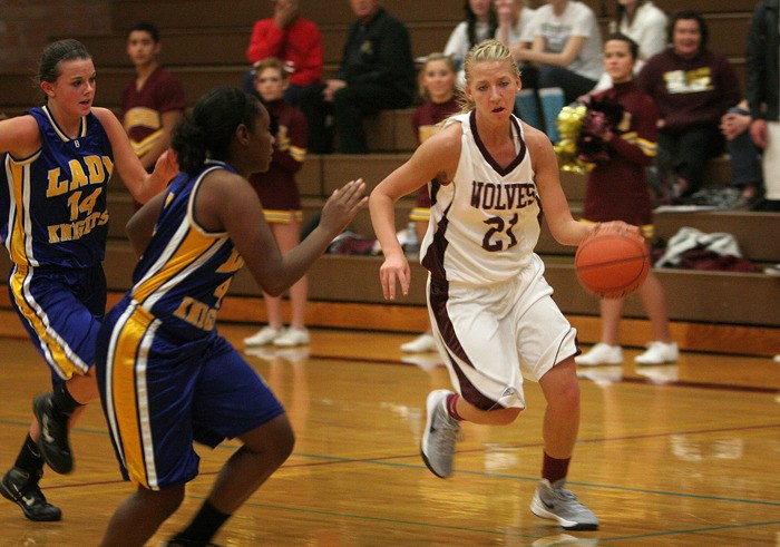 South Kitsap senior forward Taylor Sunkel celebrated her 18th birthday by scoring a game-high 26 points to lead the Wolves to a 70-53 season-opening win Tuesday night against Bremerton.