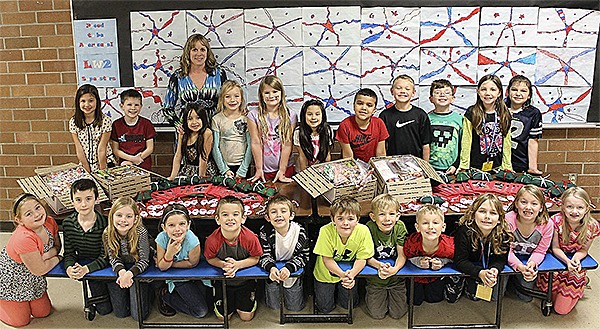 Lisa Wickens and her class hosted an after-school event for students to make Santa ornaments and pillows to send to soldiers serving over seas this holiday season. Wickens class with all of the gifts to send overseas.