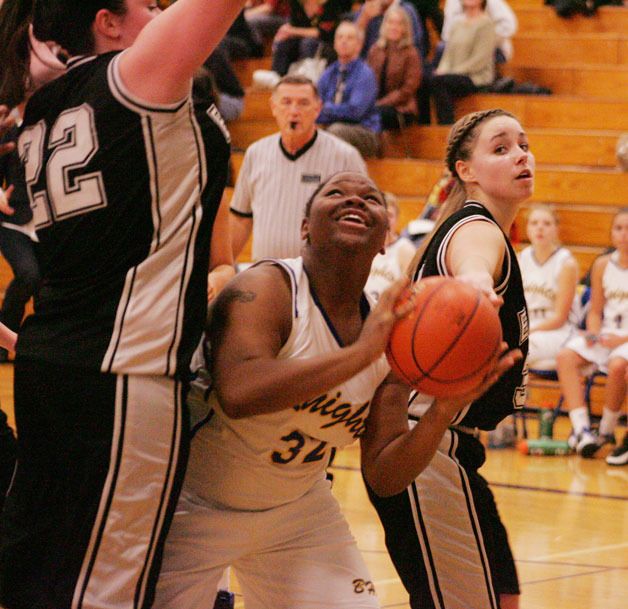 The Knights Eboni Harpes goes up for a layup in Tuesday night’s game against the Klahowya Eagles.