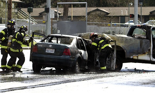 A car and a pickup burned after a rear-end collision at Highway 305 and Hostmark Street