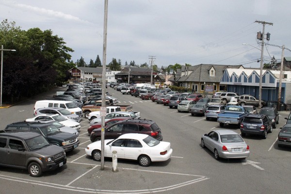The city may begin charging for downtown parking in order to make spaces more available.