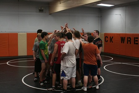 The Cougars’ wrestling team wraps up practice last week. The team starts the season on Dec. 4.