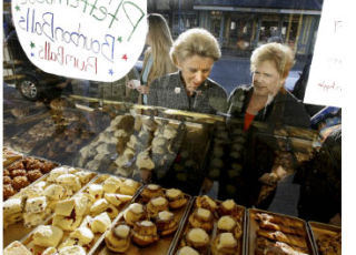 Gov. Chris Gregoire (left) and Rep. Sherry Appleton contemplate the wares at Pouslbo’s Sluys Bakery during Gregoire’s visit to Kitsap earlier this year.