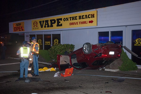 Police and firefighters work at the scene of a multiple vehicle crash at the intersection of Kitsap Way and National Avenue around 9:30 p.m. Nov. 6