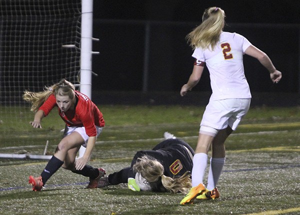 Emma Keeling makes a save during the State game against Archbishop Murphy in 2013. Keeling returns as the the goalie for the Bucs in 2014.