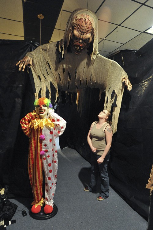 The North Kitsap Eagles opened  its haunted house at the club’s Aerie on Lincoln Road Thursday night. The house is open 6-11 p.m. through  Sunday. Volunteer Emily Rose inspects a ghoulish installation.