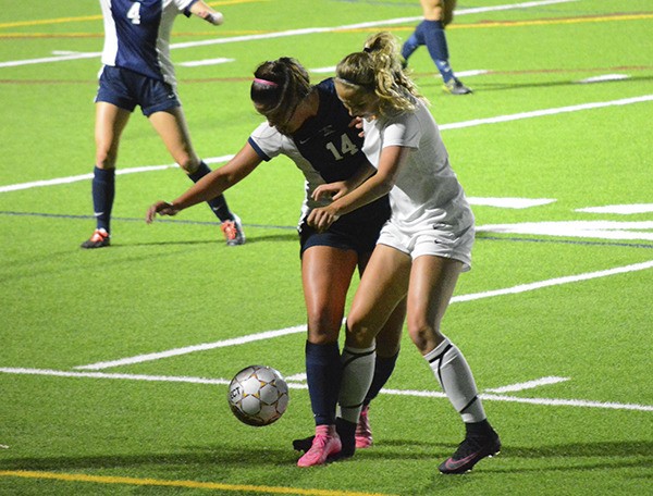 Midfielder Savannah Foster challenges for a ball during South Kitsap’s girls soccer match against Bellarmine Sept. 20. The Wolves’ lost in a heartbreaking 2-1 finish when the Lions scored in the final minute of play.