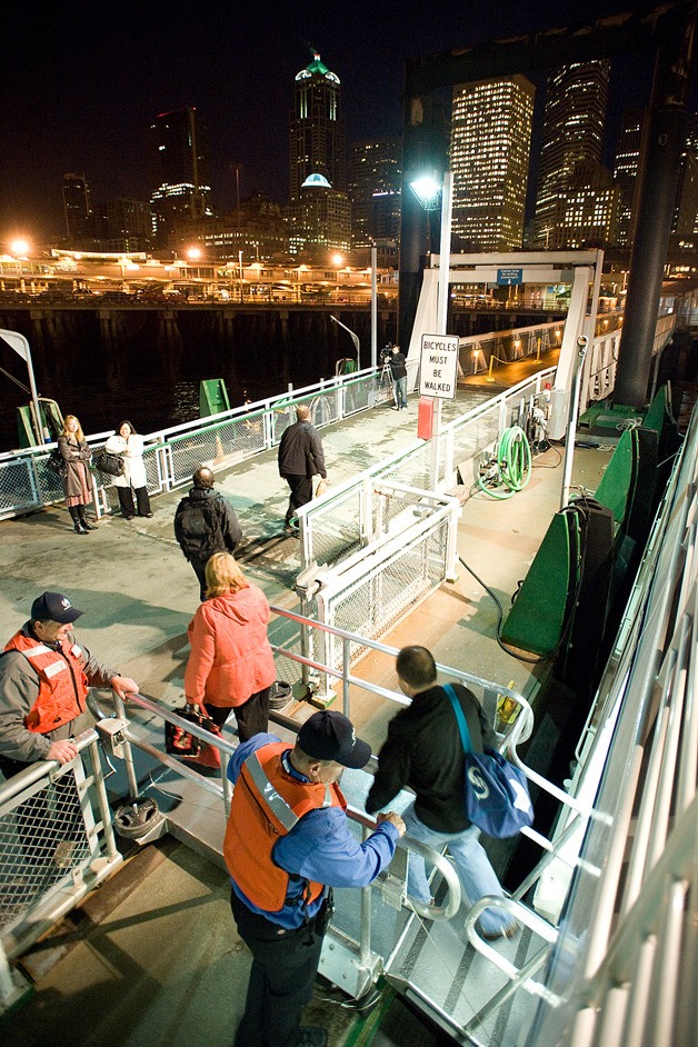 Passengers depart the first sailing of Kingston to Seattle passenger ferry at Colman Dock Monday morning.