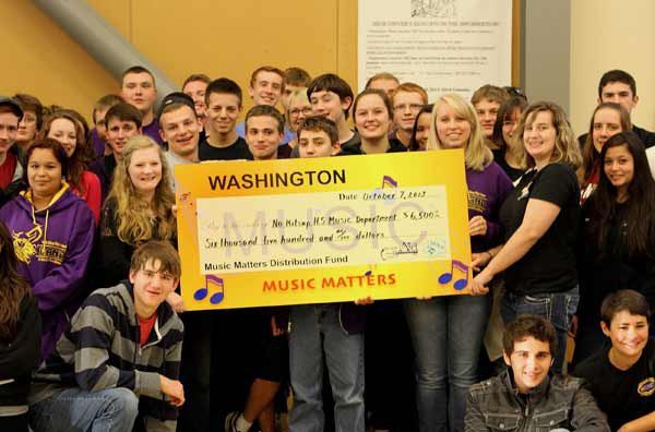 North Kitsap High School students hold up a check for $6
