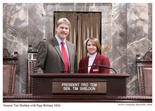 Brittany Mills stands with Sen. Tim Sheldon on Feb. 14.