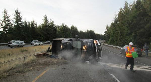 A wrecked Ford F-250 pickup truck that rolled over blocks the southbound lane of State Route 3 near Bremerton Aug. 27.