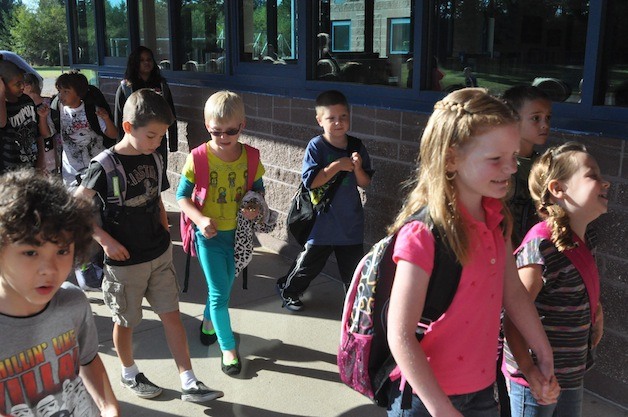Students at Bremerton’s Kitsap Lake Elementary School head for the first day of classes Wednesday following the morning bell. State testing results show local schools to be keeping pace with statewide improvements in math and science scores.