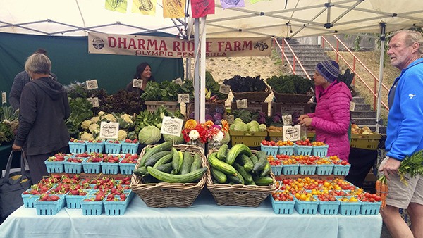 Dharma Ridge Farms sell their fresh produce at the Poulsbo farmers market during the 2016 season.