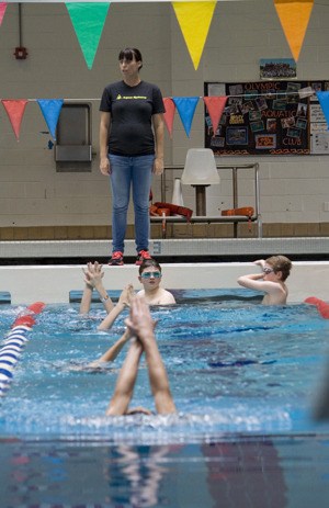 Olympic swimmer Amanda Beard helps teach local aquatic club swimmers  during a recent visit.