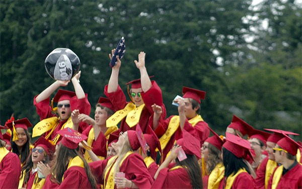 Kingston High School 2016 graduates bounce beach balls and celebrate their milestone during their graduation ceremony on June 11.