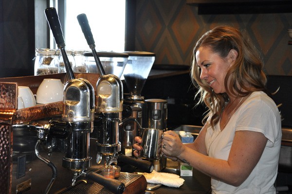 Jen Dobbelaere works the espresso machine at Whiskey Gulch Coffee Co. Whiskey Gulch