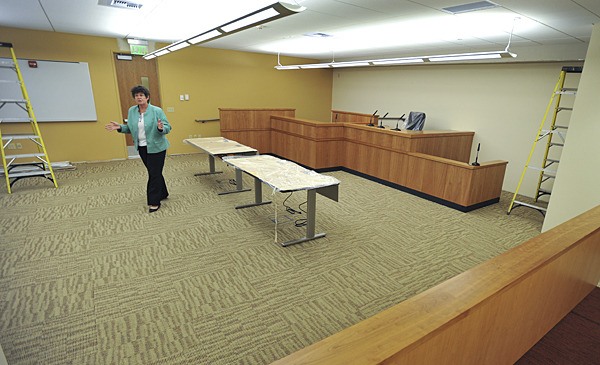 Poulsbo Mayor Becky Erickson gives a spot tour of the unfinished Municipal Court courtroom in the new City Hall in October. The City Council will vote April 20 on a plan to move the police department into offices next to the courtroom.